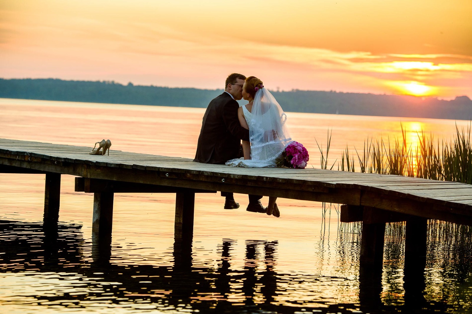 Hochzeitsfotograf Starnberger See, am Steg bei Sonnenuntergang